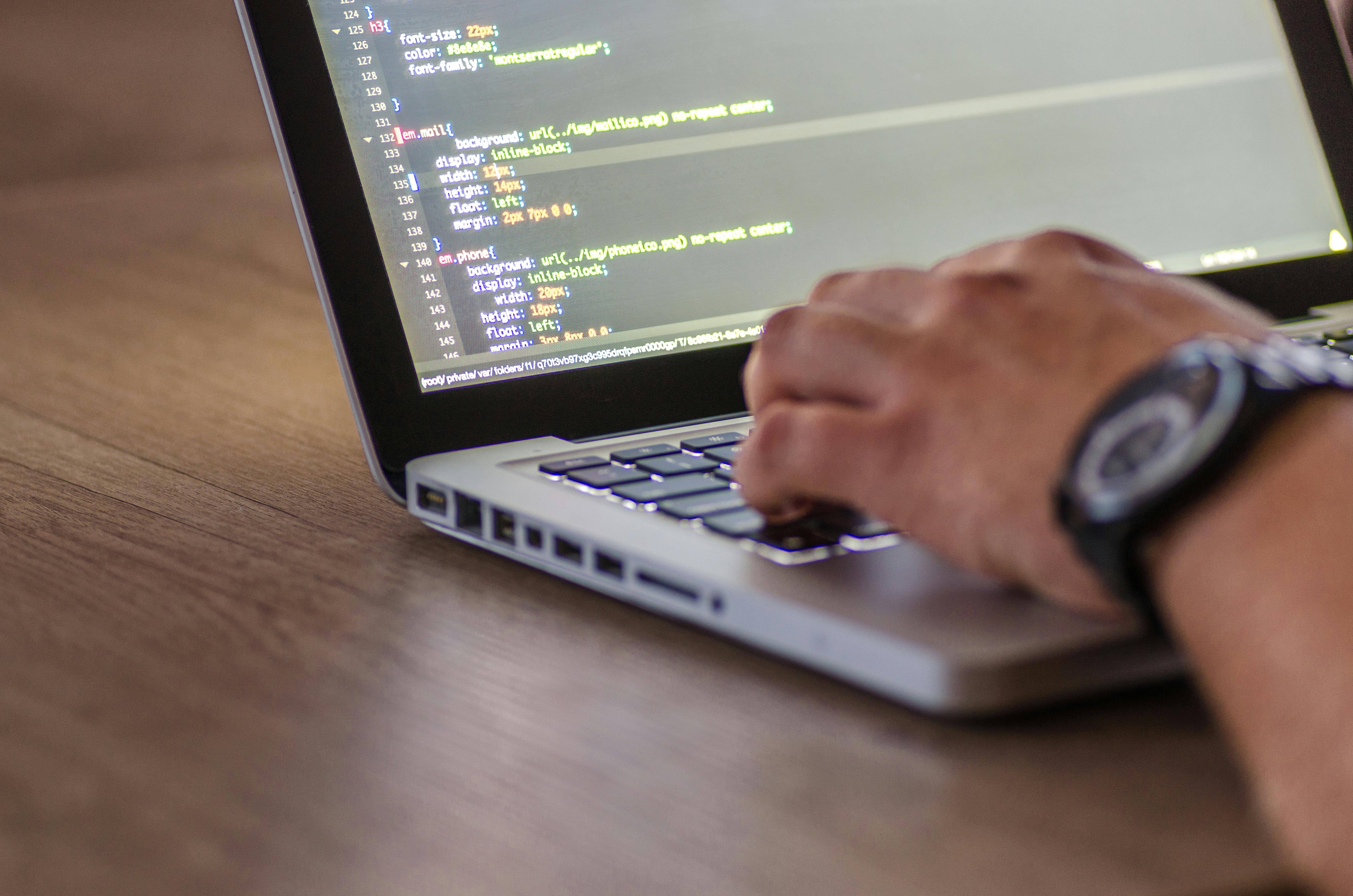 writing code on a laptop