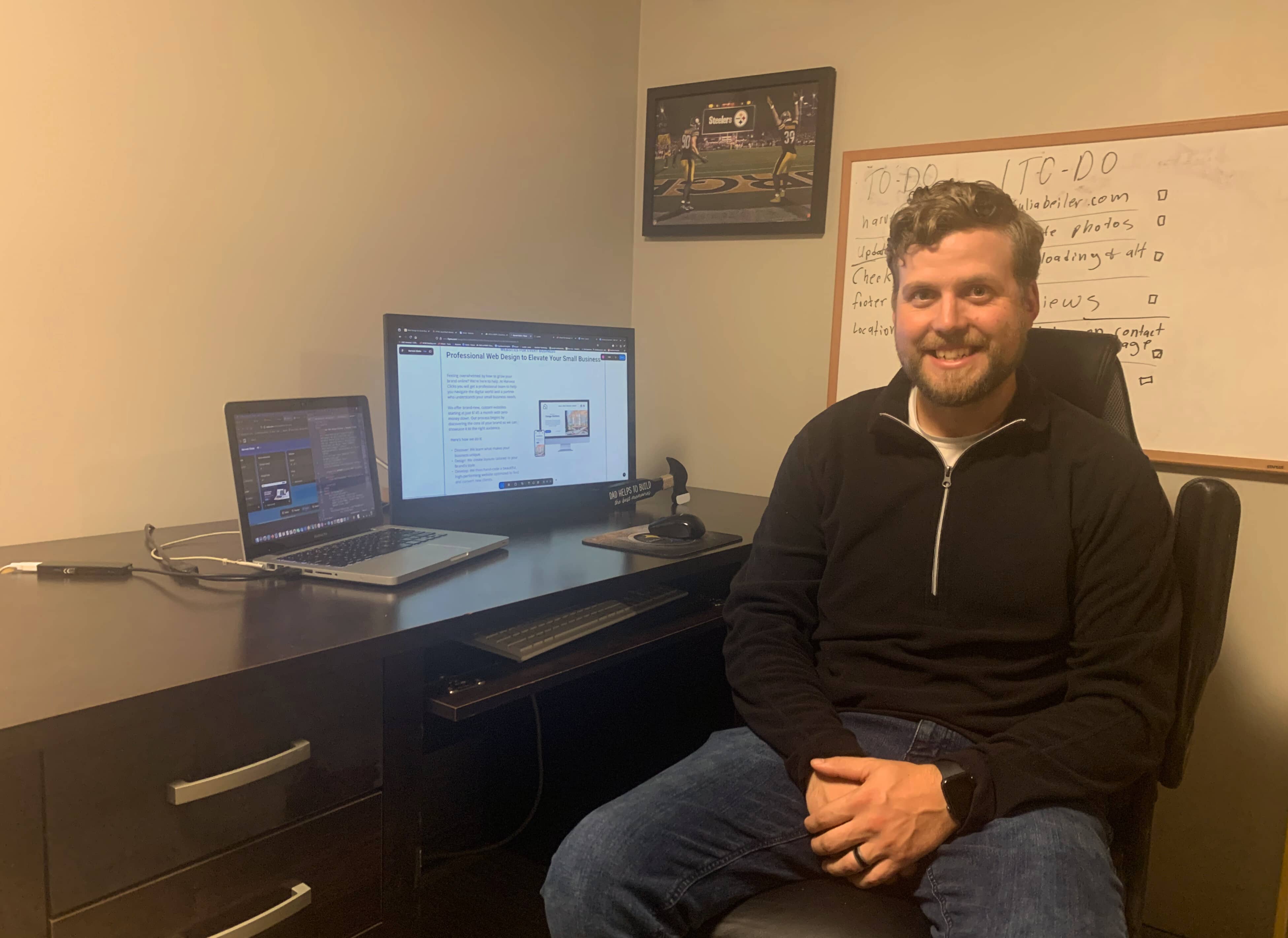 Andrew Beiler sitting in front of desk and computer